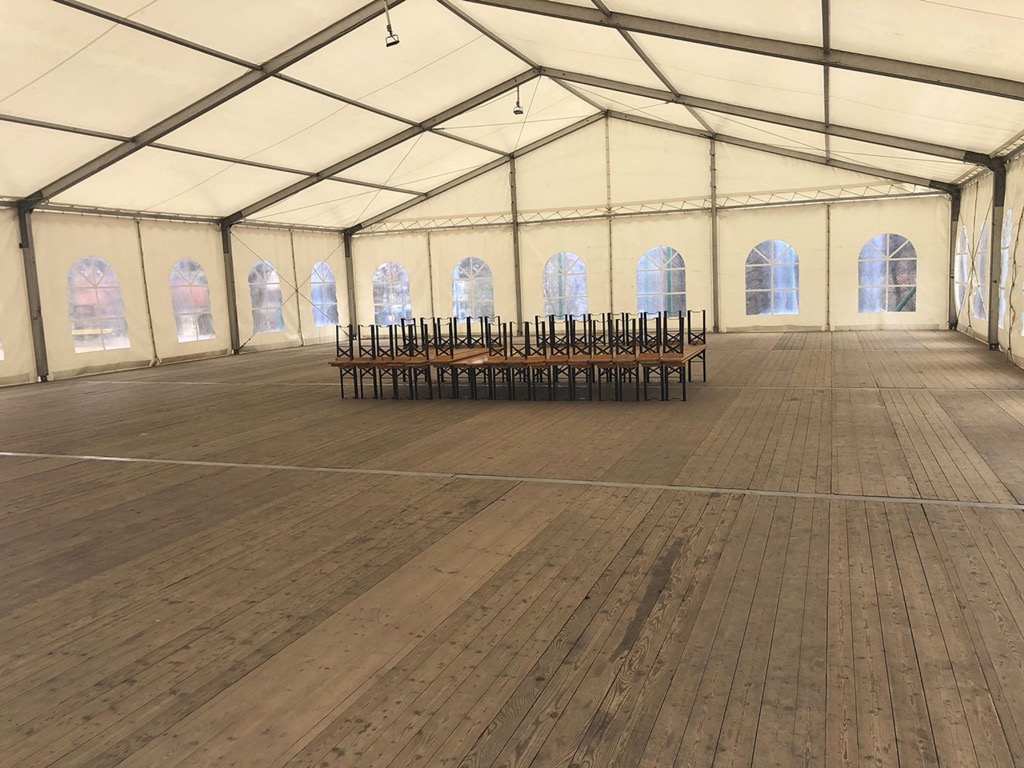 Tent with flooring and benches